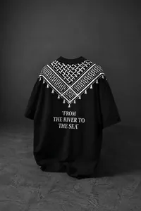 Detailed view of black oversized crew neck T-shirt with white Keffiyeh pattern on the back