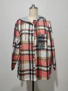 Detailed view of the red and black plaid pattern on a long-sleeved hooded women's jacket.
