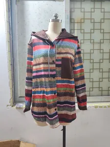 Close-up of colorful striped hooded shirt with brown pocket on mannequin.
