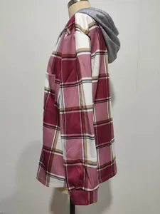 Side view of red plaid women's hooded jacket featuring a grey knit hood and side pocket