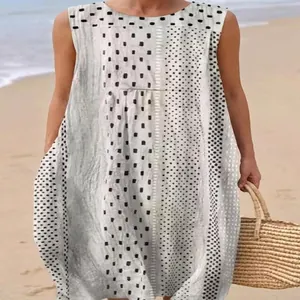 Sleeveless long dress featuring unique black and white polka dot and geometric prints.