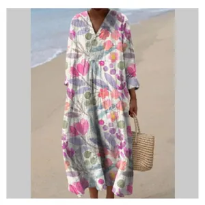 Full-body view of a bohemian floral maxi dress modeled on a sunny beach background