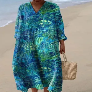 Elegant bohemian loose V-neck maxi dress featuring a vibrant blue and green peacock feather print