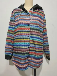 Detail of a women's casual hooded jacket featuring colorful zigzag print and front buttons