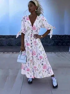 Elegante bloemen maxi-jurk met V-hals, strikdetails aan de mouwen en knoopsluiting