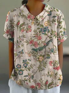 Detailed view of the vintage floral and bird print on women's lapel casual shirt