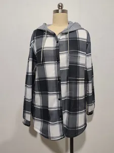 Detail of a black and white plaid hooded shirt on a mannequin