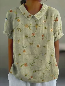 Elegant sage green women's short sleeve blouse with floral print and Peter Pan collar