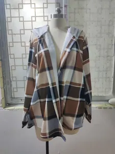 Detailed view of a casual women's brown plaid hooded jacket displayed on a white mannequin