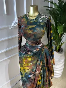 Detailed view of a long-sleeved evening gown with abstract teal and orange prints.