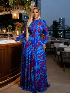 Elegant long sleeve mesh maxi dress with vibrant blue and red geometric tie-dye print
