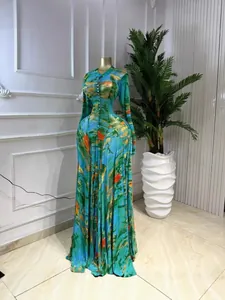 Elegant long-sleeved mesh maxi dress featuring a vibrant artistic tie-dye print design