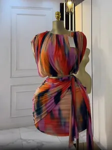 Detail of summer tie-dye sleeveless top and pleated skirt set on mannequin