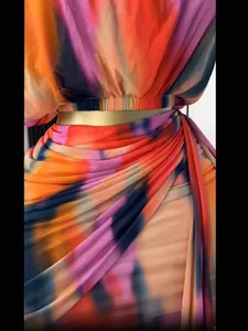Detailed view of a 2025 summer colorful tie-dye pleated two-piece skirt and top set