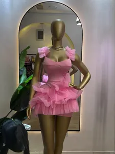 Sweet pink sleeveless ruffle mini dress with a slim waist and tiered mesh skirt