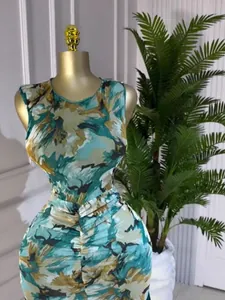Sleeveless round neck dress featuring an elegant teal and gold tie-dye floral print.