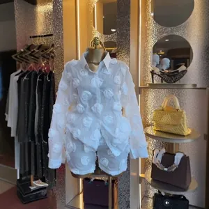 Elegant white 2-piece organza set featuring 3D rose flower appliqués on shirt and shorts.