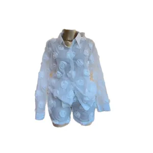 Detail view of white 3D rose floral organza two-piece set shirt and shorts
