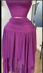 Detail view of the purple mesh layered skirt and cropped top set on a mannequin