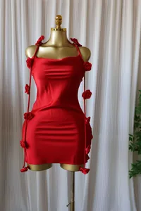 Red sleeveless mini dress with 3D floral accents on hanging straps on a mannequin
