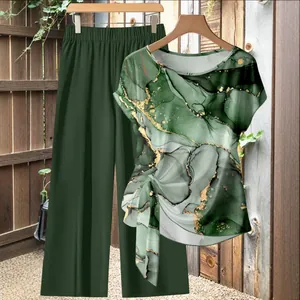 Two-piece set featuring a green marble print knot top and matching dark green wide-leg trousers.