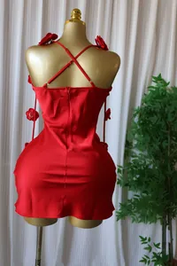 Detailed back view of red satin cami dress with unique 3D floral pin decorations