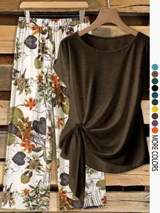 Casual women's 2-piece outfit featuring a twist-knot top and floral wide-leg pants