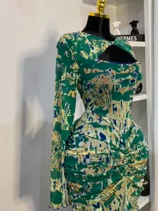 Detailed view of abstract print dress with hollow-out chest and pleated waist design