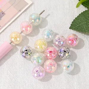 Close-up macro view of colorful 16mm iridescent crackle beads for DIY jewelry crafts