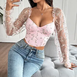 Detail of pink floral embroidered mesh corset top with underwire and long sleeves
