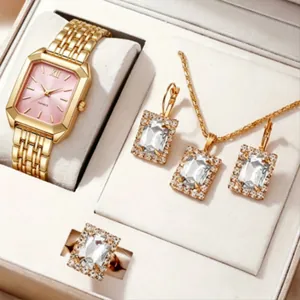 Gros plan détaillé de l'élégante montre carrée dorée et de la parure de bijoux en boîte cadeau