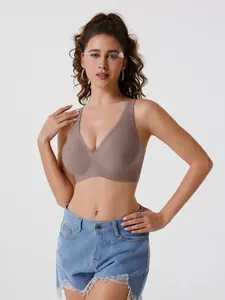 Professional shot of seamless deep V-neck wireless bra in mocha brown on model