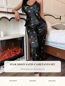Elegant black star and moon celestial print satin cami and long pants pajama set.