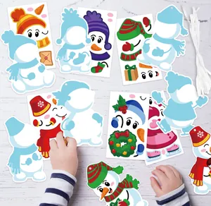 Detail showing a child assembling colorful DIY snowman Christmas tree hanging card stickers