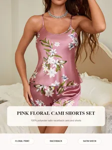 Close-up detail of a pink floral print satin cami and shorts pajama set for women