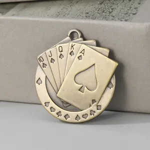 Close-up of vintage bronze alloy playing cards pendant with Royal Flush design