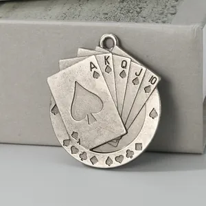 Detailed view of vintage silver alloy poker card pendant featuring Royal Flush in Spades.