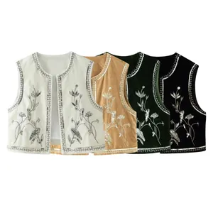 Vista dettagliata di gilet etnici in velluto ricamati con paillettes in 4 colori