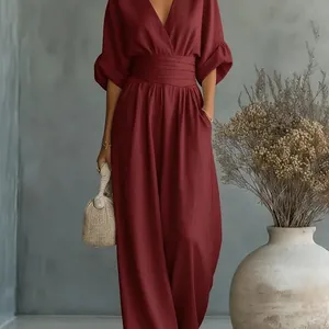 Elegant maroon V-neck wide leg jumpsuit with cinched waist for a flattering slim fit