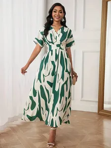 Full view of elegant women's maxi dress with green abstract print and V-neckline