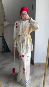 Elegant cream floral print long-sleeved shirt and maxi skirt set for a modest fashion look.