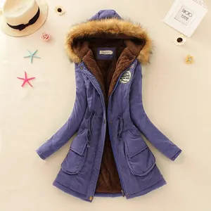 Close-up showing the warm brown faux fur lining and purple fabric of women's parka coat