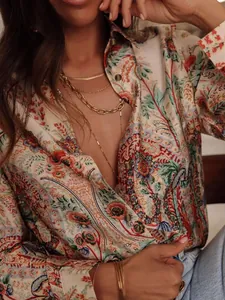 Detailed view of bohemian floral print on women's long sleeve lapel holiday shirt.