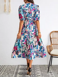 Rear view of a stylish floral print midi dress with V-neck and puff sleeves detail