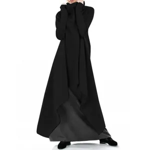 Detailed shot of an oversized black high-neck sweatshirt dress with asymmetrical hem
