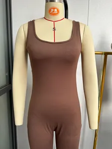 Close-up detail view of a slim fit brown sleeveless yoga jumpsuit on a mannequin