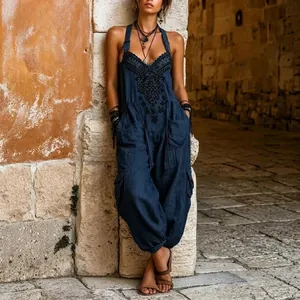 Full-length view of navy blue bohemian jumpsuit with intricate chest embroidery