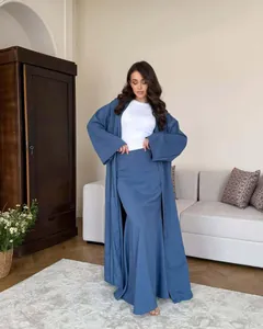 Elegant blue cotton linen long cardigan and skirt two-piece set shown on a model in a room