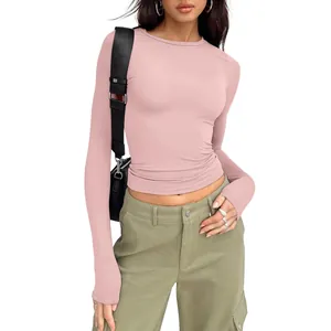 Detail of slim-fit pink long sleeve t-shirt for women in soft stretch fabric.