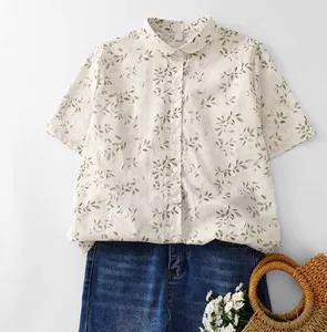 Detailed view of women's floral printed shirt featuring a classic Peter Pan collar